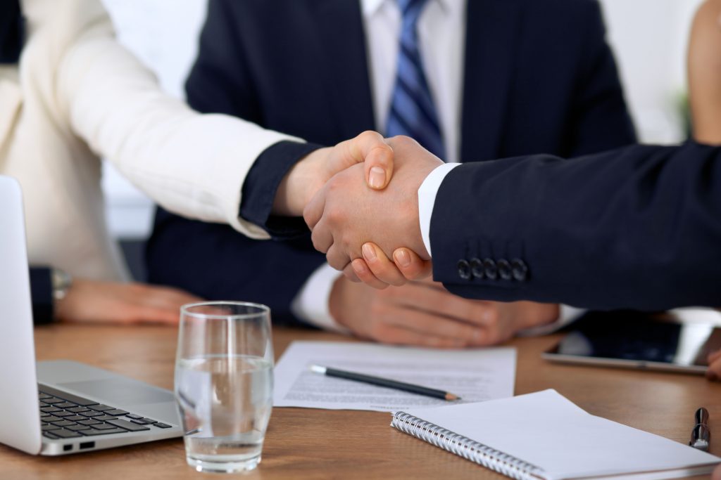Close,Up,Of,Business,People,Shaking,Hands,At,Meeting,Or